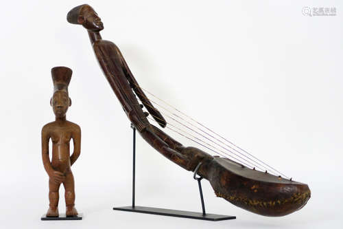 two Congolese items of the “Mangbetu” : a female figure in wood and a string instrument with a sculpture