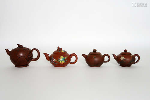 four Chinese ‘Yixing’ teapots in marked earthenware with painted decoration