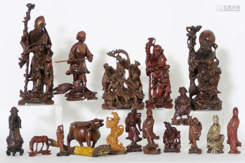 several Chinese sculptures in wood