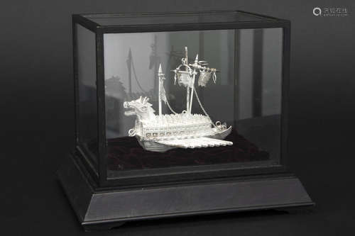 small sculpture in silver – in small displaycabinet