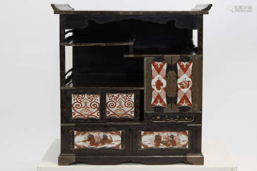 antique Japanese tea-cabinet in lacquered wood and porcelain