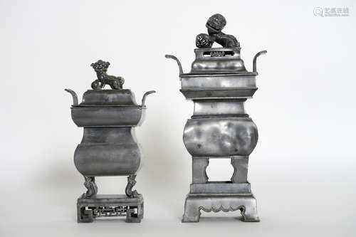 two Chinese lidded incense burners on their base in pewter