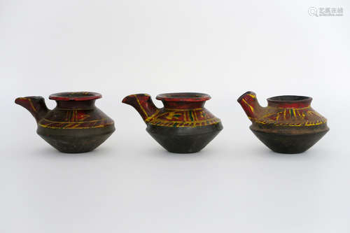 three small Nepalese moil jars in painted clay to make offerings (to keep the temple oillamps burning)