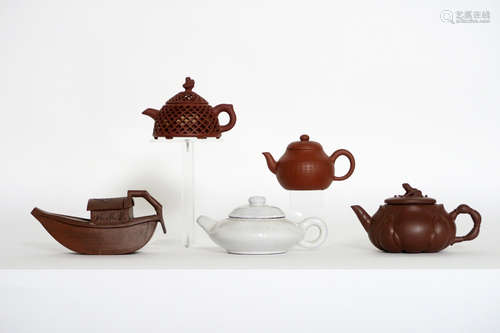 five Chinese teapots in marked “Yixing” earthenware