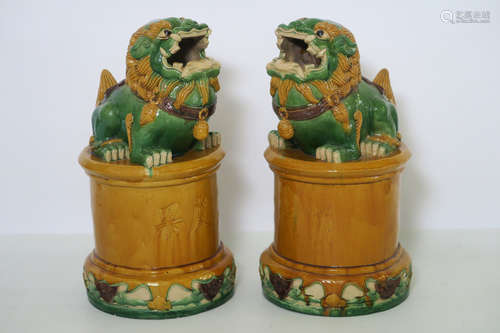 pair of Chinese ‘Temple lions’ garbish pots in glazed earthenware