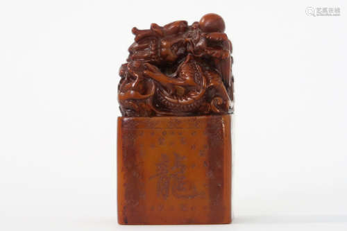 antique Chinese lacquer stamp in red soapstone with a finely sculpted fô dog on top