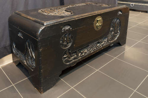 Chinese chest in lacquered camphor wood with finely sculpted scenes and original mountings