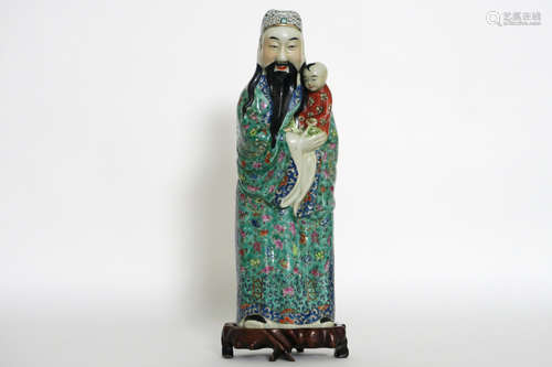 Chinese “Sage with child” sculpture in porcelain  –  with its original base