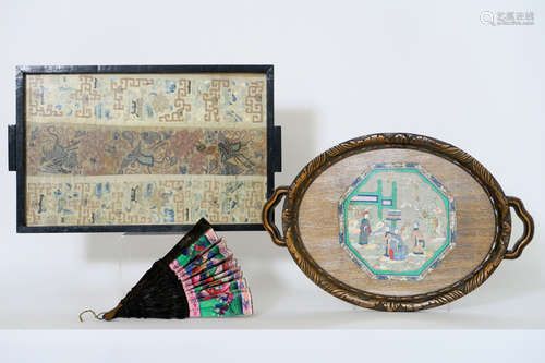 antique Chinese textile : a piece of a sleeve (in a dinnertray), a framed fan (with ivory) and a fan with “A thousand Faces”