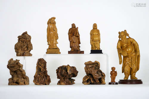 several Chinese sculptures, some in burr wood and some from the ‘Cultural Revolution’ period