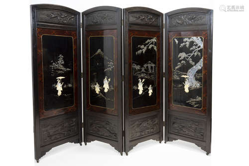 antique Chinese screen in partially sculpted wood and with lacquered panels with mother of pearl and ivory