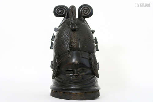 probably (because of the shape of the hat) 1920’s African ‘Mende’ mask in wood with an old local restoration