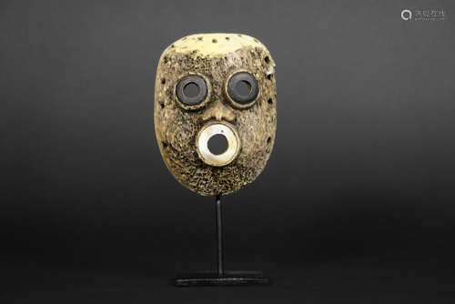 small British Columbian ritual mask from Vancouver Island in whale bone, used by shamans to communicate with the spirits during rituals and as a protection against evil spirits