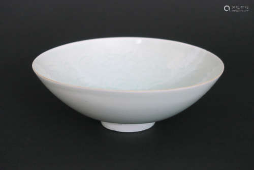 dish in fine, celadon porcelain with abstract decoration