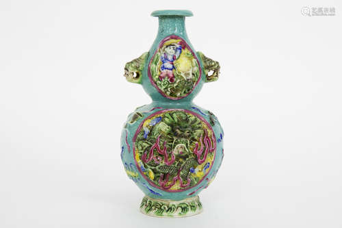 small antique Chinese vase in marked porcelain with a polychrome decor (with dragons) in relief