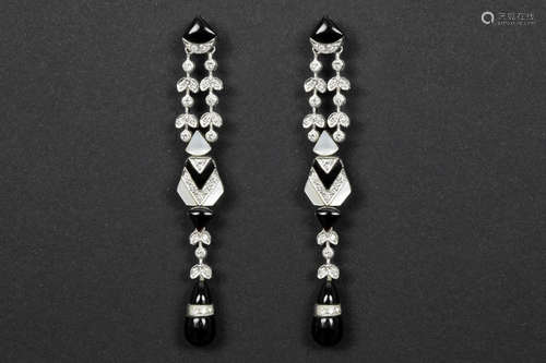 very classy pair of of old Art Deco style earrings in platinum with mother of pearl, black onyx and ca 0,50 carat of high quality brilliant cut diamonds