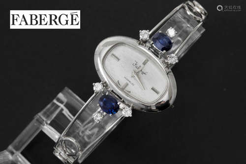 ”Fabergé” ladies’ wristwatch in white gold (18 carat) with ca 2,50 carat of sapphire and ca 0,50 carat of brilliant cut diamonds – marked