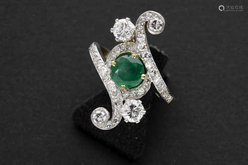 old Art Nouveau-style ring in yellow and grey gold (18 carat) with a 1,20 carat emerald and ca 1,30 carat of high quality brilliant cut diamonds