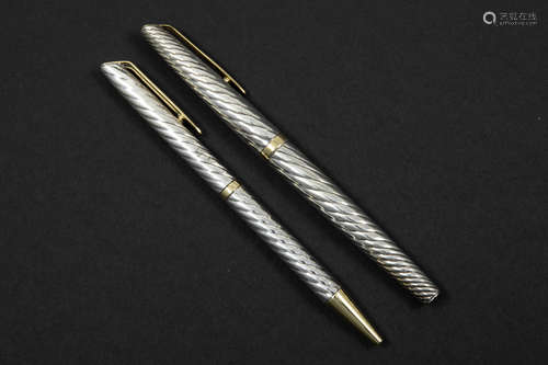 set of a pen and a ballpoint pen in silver and gold