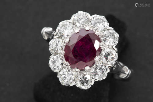 ring in white gold (18 carat) with an oval ca 2,20 carat Siamese ruby and ca 1,30 carat of  quality brilliant cut diamonds