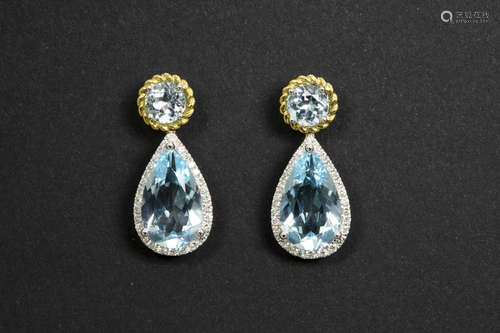 elegant pair of earrings in yellow and white gold (18 carat) with more then 12 carat of topaz and more then half a carat of very high quality brilliant cut diamonds