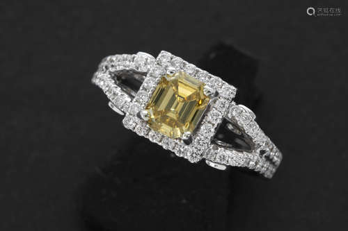 ring in white gold (18 carat) with a fancy color emerald cut diamond of 1,26 carat surrounded by more then 0,70 carat of very high quality brilliant cut diamonds