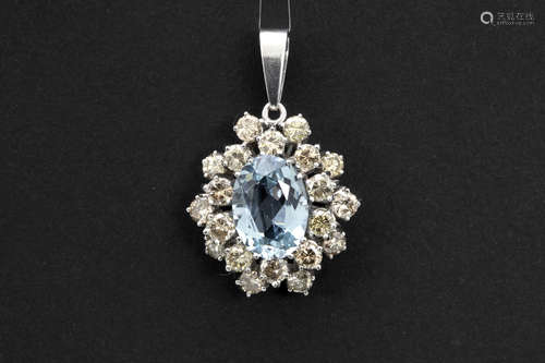 pendant in white gold (14 carat) with an oval ca 4 carat aquamarine and ca 3 carat of brown brilliant cut diamonds