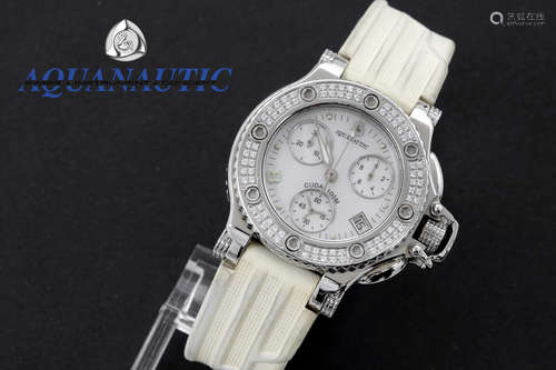 completely original quartz “Aquanautic” ladies’ wristwatch in steel with face surrounded by brilliant cut diamonds with wristband in white rubber – marked