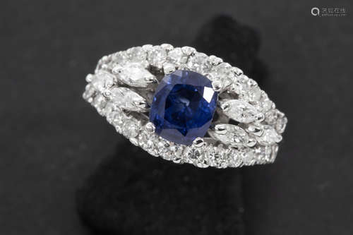 ring in white gold (18 carat) with a ca 1,10 carat sapphire from Ceylan and ca 0,90 carat of high quality brilliant cut diamonds