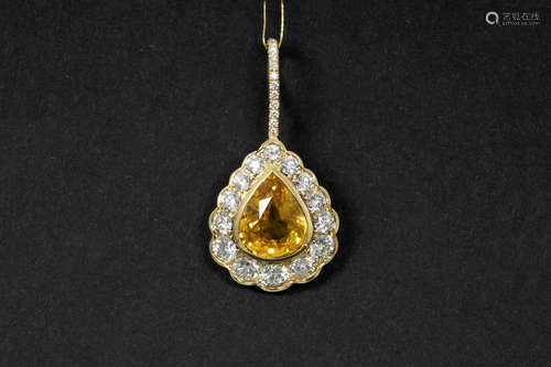 pearshaped pendant in yellow gold (18 carat) with a ca 3,60 carat yellow sapphire and ca 1,70 carat of very high quality brilliant cut diamonds