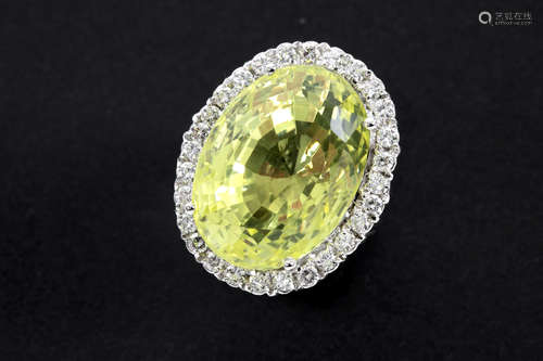 ring in white gold (18 carat) with an oval at least 40 carat ‘Lemon quartz’ surrounded by at least 1,30 carat of very high quality brilliant cut diamonds