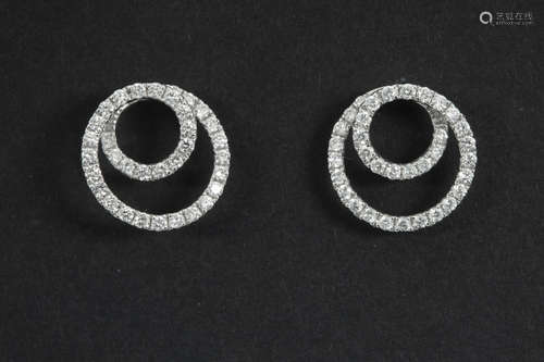 pair of spiral shaped earrings in white gold (18 carat) with ca 0,75 carat of very high quality brilliant cut diamonds