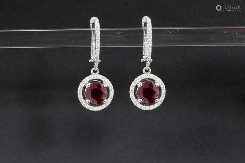 pair of earrings in white gold (18 carat) with 2,64 carat of Burmese ruby and ca 0,80 carat of very high quality brilliant cut diamonds