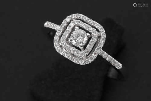 matching ring in white gold (18 carat) with ca 0,40 carat of very high quality brilliant cut diamonds