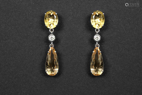 elegant pair of earrings in white gold (18 carat) with ca 4,50 carat of yellow topaz, 0,12 carat of high quality brilliant cut diamonds and ca 2,80 carat of rare “imperial topaz” with typical color