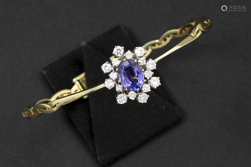 bracelet in yellow and white gold (14 carat) with a ca 2 carat tanzanite and ca 1,20 carat of  quality brilliant cut diamonds