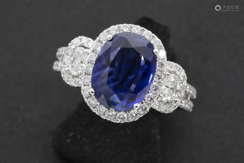 very nice ring in white gold (18 carat) with an oval 3,37 carat non-treated Burmese sapphire, surrounded by ca 1,35 carat of high quality brilliant cut diamonds  –  with a “GRS” certificate for the sapphire
