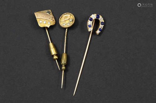 three pins in yellow gold (18 carat), one with ca 0,50 carat of sapphire and ca 0,60 carat of very high quality bolsjevic cut diamonds