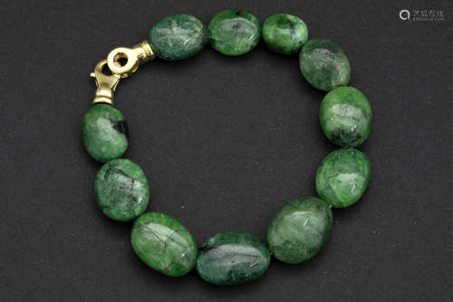 bracelet with quite big emerald beads (ca 150 carat with cabochon cut) and with a lock in yellow gold (18 carat)