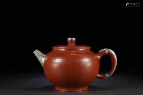 A PURPLE CLAY TEAPOT