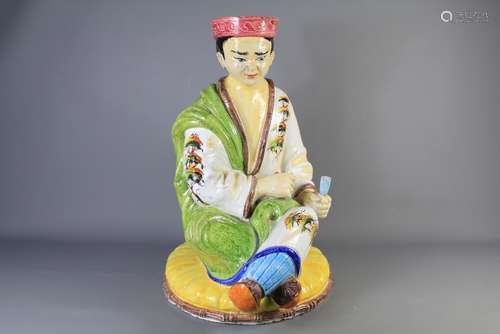 A Chinese Porcelain Figure, clutching a document in his left hand, approx 60 cms h x 40 cms w (base)