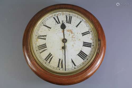 A Round Mahogany-Cased Wall Clock