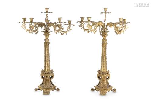 A LARGE PAIR OF MID 19TH CENTURY ITALIAN GILT BRONZE CANDELABRA the shafts decorated with laurel