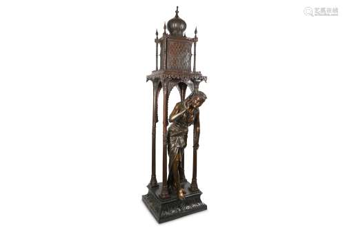 A LARGE AND IMPRESSIVE ORIENTALIST BRONZE FIGURE OF AN ARAB MAIDEN the standing figure wearing a