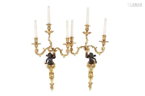 A LARGE PAIR OF LOUIS XVI STYLE GILT AND PATINATED BRONZE WALL APPLIQUES  the backplates modelled