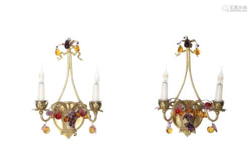 A PAIR OF REGENCY STYLE GILT BRASS AND COLOURED GLASS LUSTRE CANDELABRAS modelled as lyres over