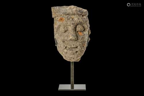 A 13TH CENTURY GOTHIC CARVED LIMESTONE HEAD an architectural fragment, now raised on a metal