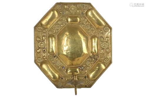 A 17TH CENTURY FLEMISH REPOUSSE BRASS WALL SCONCE of octagonal form, with rope twist borders and