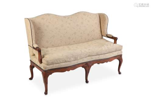 A MID 18TH CENTURY FRENCH WALNUT UPHOLSTERED OPEN ARM SETTEE the cream upholstery decorated with