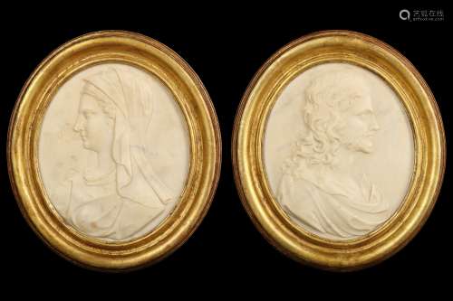 A PAIR OF EARLY 18TH CENTURY FRENCH MARBLE RELIEFS OF THE VIRGIN AND CHRIST AFTER THE MODEL BY